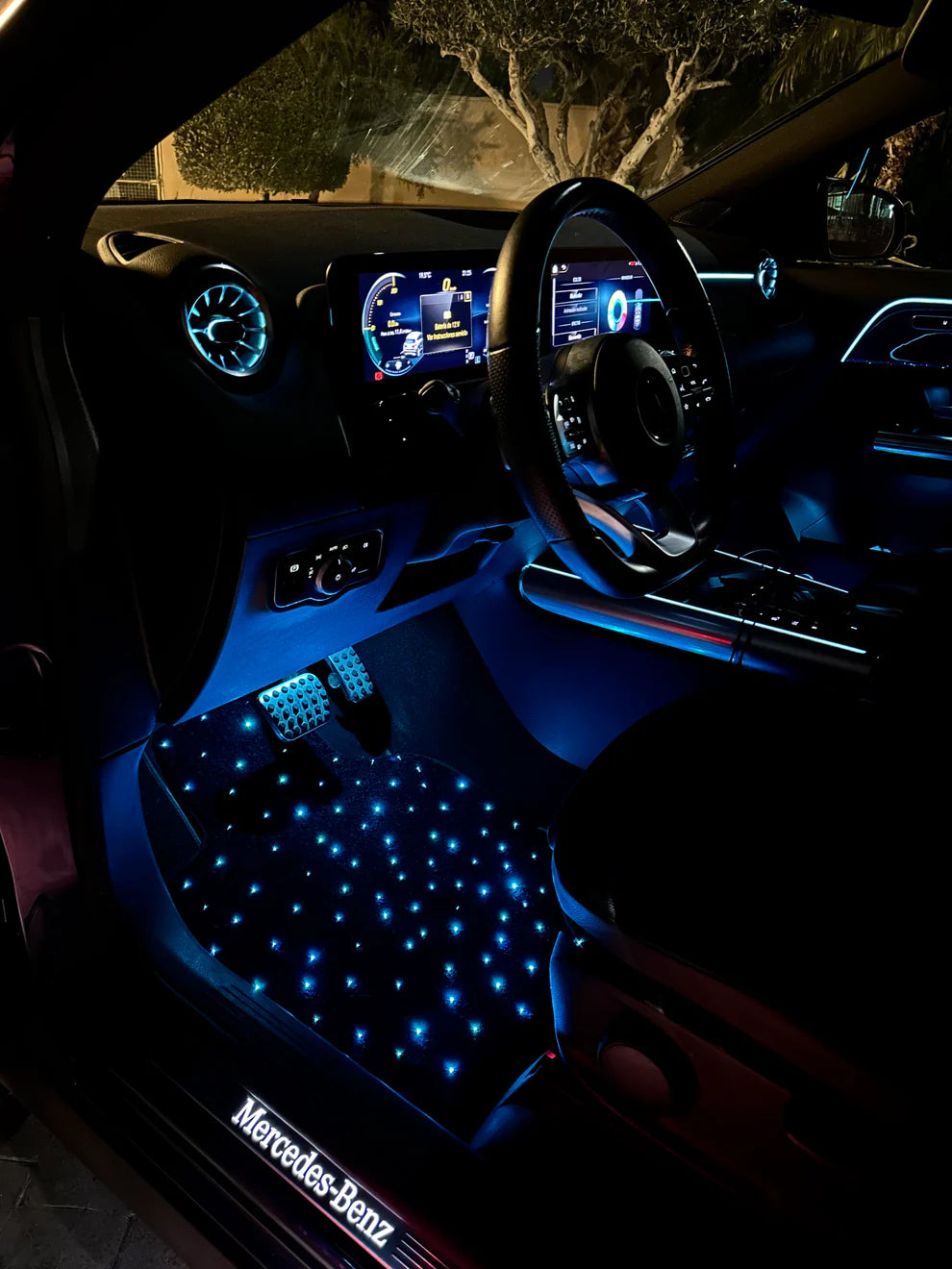 Blue starlight car floor mats installed in vehicle – ambient fiber optic glow for a luxury driving experience