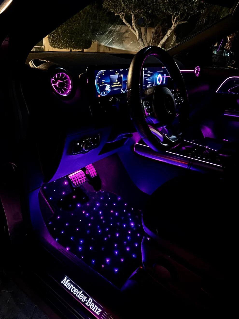 Purple glowing starlight car mat with adjustable fiber optic lighting – multi-color ambient floor mat by CarmatStars