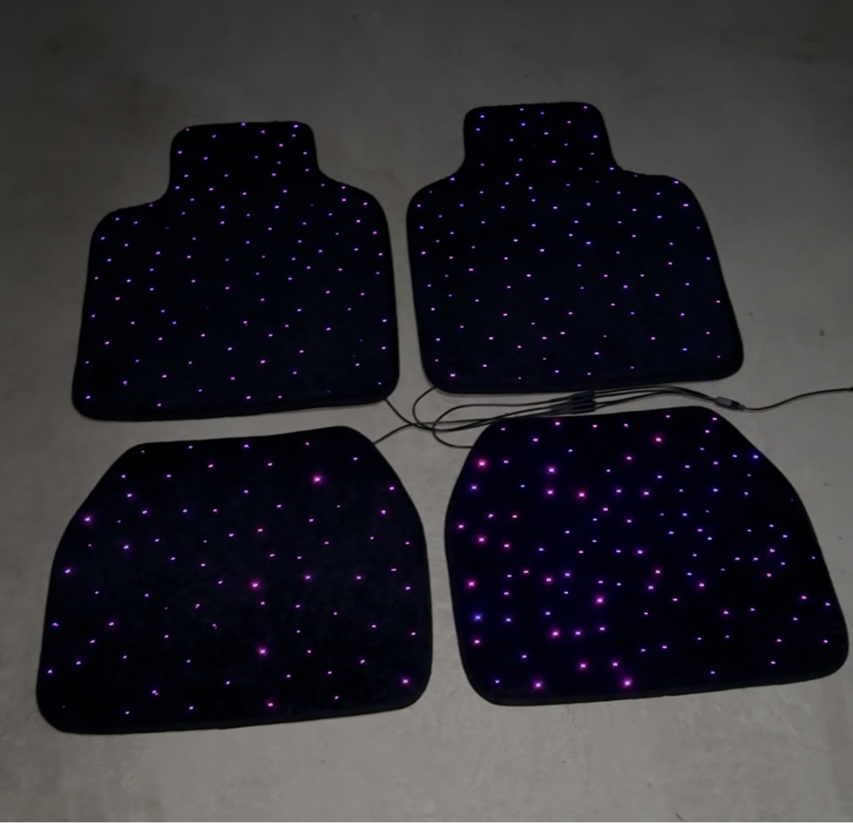 Starlight car mat with visible wiring and fiber optic system – demonstration of installation components and lighting setup by CarmatStars